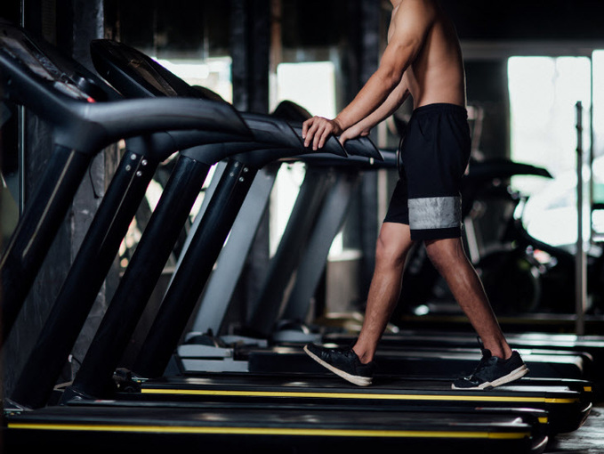 Young man in sportswear an exercise class in a gym