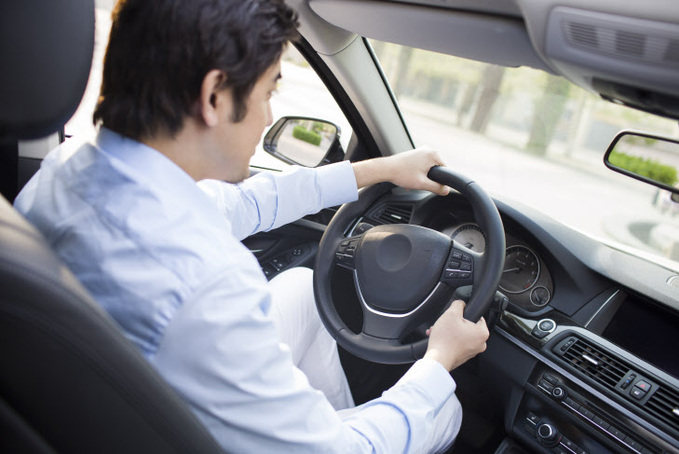 Young man driving car